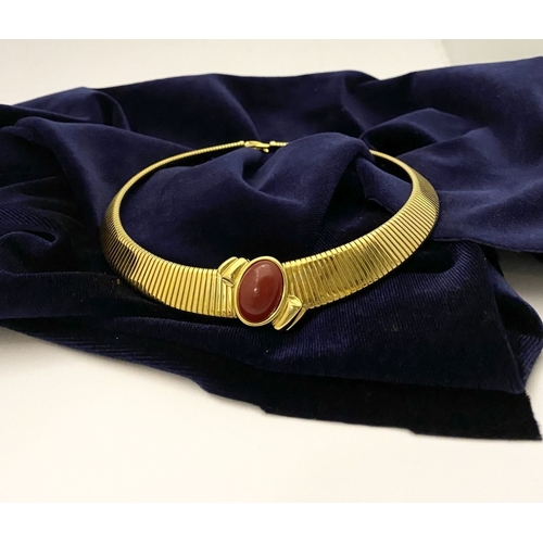 149 - A VINTAGE MONET GOLD TONE OMEGA COLLAR NECKLACE, c.1980, the gold-tone collar featuring an oval-shap... 