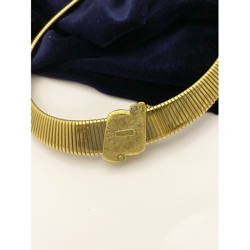 149 - A VINTAGE MONET GOLD TONE OMEGA COLLAR NECKLACE, c.1980, the gold-tone collar featuring an oval-shap... 