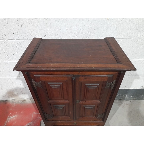 153 - A FINE MAHOGANY TWO DOOR CABINET, with raised cornice above two panelled doors over one drawer, rais... 