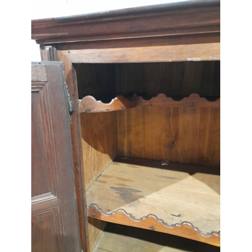 153 - A FINE MAHOGANY TWO DOOR CABINET, with raised cornice above two panelled doors over one drawer, rais... 