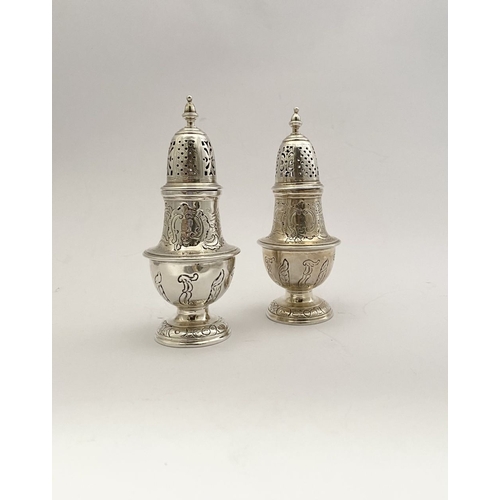 16 - A PAIR OF GEORGE II IRISH SILVER SUGAR CASTORS, Hallmarked Dublin c.1745. Of baluster form, the body... 