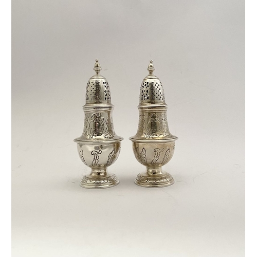 16 - A PAIR OF GEORGE II IRISH SILVER SUGAR CASTORS, Hallmarked Dublin c.1745. Of baluster form, the body... 