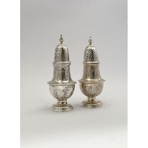 16 - A PAIR OF GEORGE II IRISH SILVER SUGAR CASTORS, Hallmarked Dublin c.1745. Of baluster form, the body... 