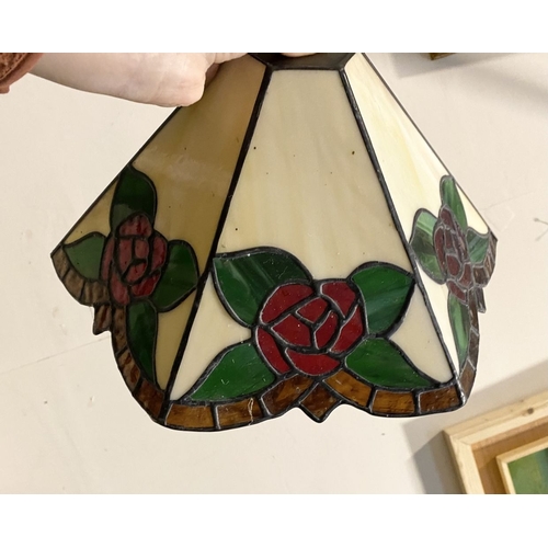 167 - A SET OF FOUR TIFFANY STYLE GLASS WALL SCONCE LAMPSHADES, each features three glass panels with rose... 