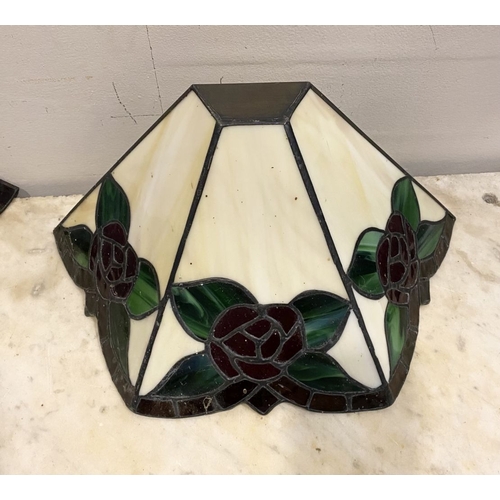 167 - A SET OF FOUR TIFFANY STYLE GLASS WALL SCONCE LAMPSHADES, each features three glass panels with rose... 