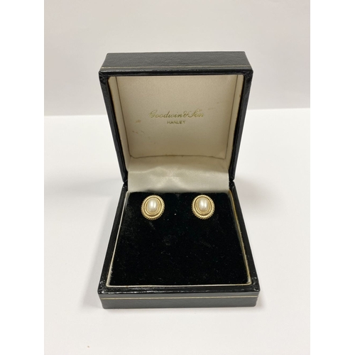 173 - A PRETTY CASED PAIR OF IMITATION PEARL STUD EARRINGS, oval imitation pearls surrounded by tope borde... 