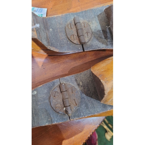 174 - A PAIR OF VINTAGE WOODEN HINGED SHOE STRETCHERS, with turned wooden handles to the heel and a strong... 