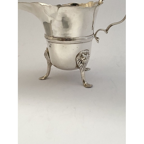 20 - A GEORGE II IRISH SILVER CREAM JUG, Dublin c.1750, nice simple form with gadrooned rim, double scrol... 