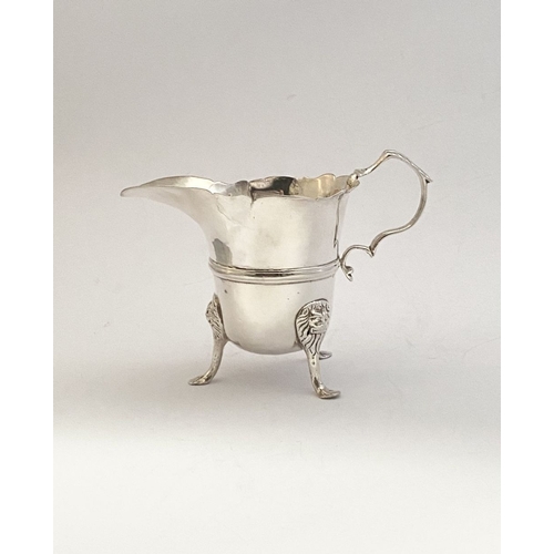 20 - A GEORGE II IRISH SILVER CREAM JUG, Dublin c.1750, nice simple form with gadrooned rim, double scrol... 