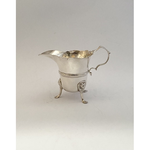 20 - A GEORGE II IRISH SILVER CREAM JUG, Dublin c.1750, nice simple form with gadrooned rim, double scrol... 