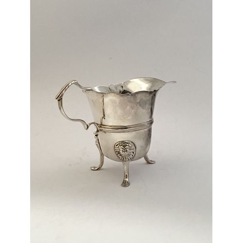 20 - A GEORGE II IRISH SILVER CREAM JUG, Dublin c.1750, nice simple form with gadrooned rim, double scrol... 