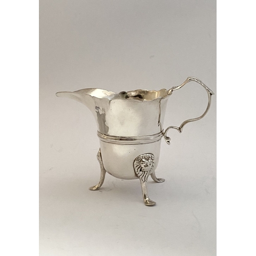 20 - A GEORGE II IRISH SILVER CREAM JUG, Dublin c.1750, nice simple form with gadrooned rim, double scrol... 