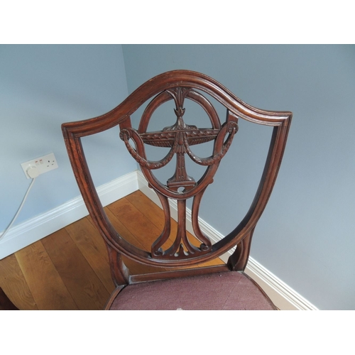 200 - A PAIR OF MAHOGANY HEPPLEWHITE STYLE 19TH CENTURY CHAIRS, each with a shield shaped back, with carve... 