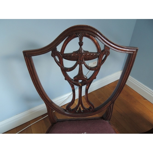 200 - A PAIR OF MAHOGANY HEPPLEWHITE STYLE 19TH CENTURY CHAIRS, each with a shield shaped back, with carve... 