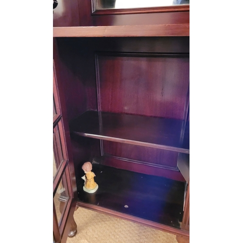 208 - A GOOD QUALITY GLAZED DISPLAY CABINET, with open mirror backed top section having fluted detail to t... 