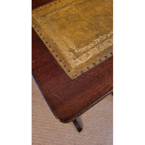 209 - A VERY GOOD NEST OF THREE LEATHER TOPPED SIDE TABLES, each with a lovely panel of gilt tooled green ... 