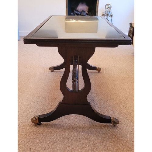 210 - A GOOD MAHOGANY GLASS TOPPED COFFEE TABLE WITH LYRE SUPPORTS, the rectangular table has a reed edge ... 