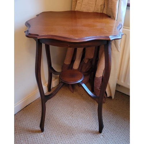 211 - A GOOD EDWARDIAN STYLE SERPENTINE SHAPED SIDE TABLE / LAMP TABLE, with stepped shaped edge to the ta... 