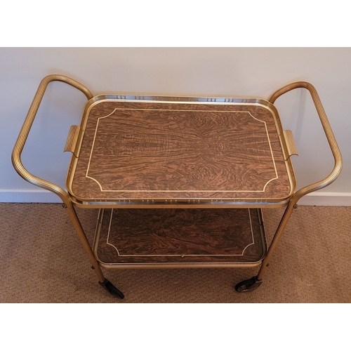 219 - A GILT METAL & FAUX WALNUT TWO TIER MID-CENTURY TROLLEY BAR CART, with lovely reed detail to the cur... 