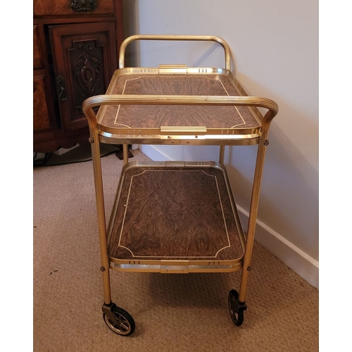 219 - A GILT METAL & FAUX WALNUT TWO TIER MID-CENTURY TROLLEY BAR CART, with lovely reed detail to the cur... 