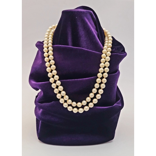 22 - A CLASSIC CULTURAL PEARL & GOLD CLASPED NECKLACE, the double hand knotted string of pearls is claspe... 