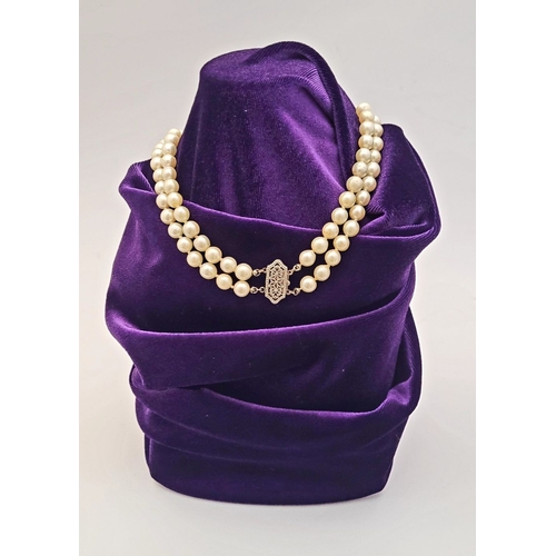 22 - A CLASSIC CULTURAL PEARL & GOLD CLASPED NECKLACE, the double hand knotted string of pearls is claspe... 