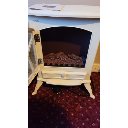 222 - A ‘WARMLITE’ STOVE EFFECT ELECTRIC STOVE FIRE, in cream metal, nice neat size. Comes with instructio... 