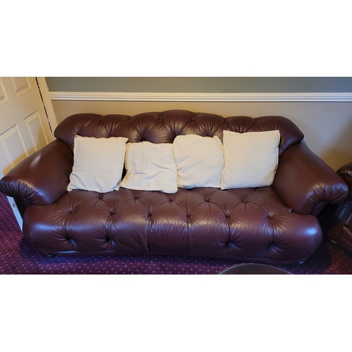 224 - A THREE-PIECE VINTAGE LEATHER LIVING ROOM SUITE, includes two large button back armchairs, with bead... 