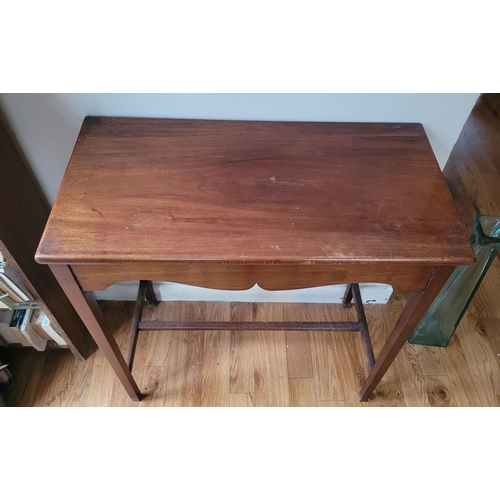 225 - A GOOD QUALITY MAHOGANY HALL / SIDE TABLE, with shaped skirt to the front raised on tapered legs, un... 