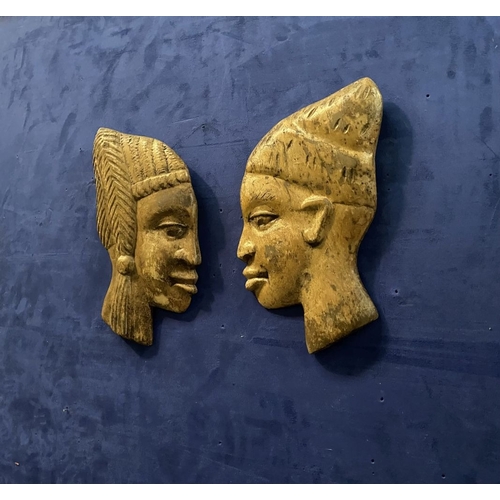 243 - A PAIR OF CARVED AFRICAN BUSTS IN PROFILE, hardwood carvings, can be mounted on a wall. Dimensions: ... 