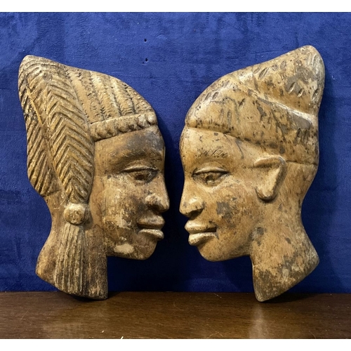 243 - A PAIR OF CARVED AFRICAN BUSTS IN PROFILE, hardwood carvings, can be mounted on a wall. Dimensions: ... 