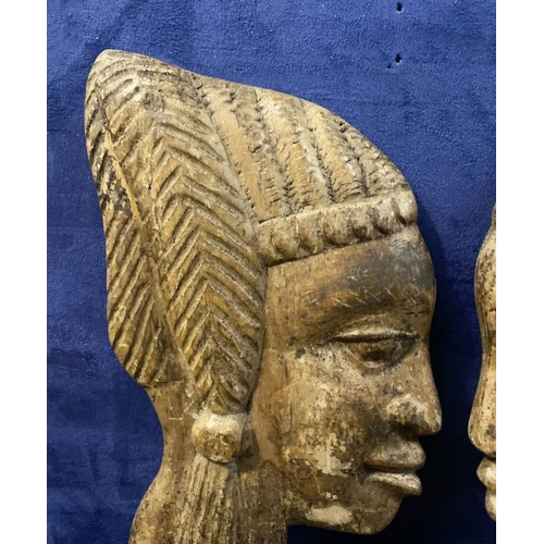 243 - A PAIR OF CARVED AFRICAN BUSTS IN PROFILE, hardwood carvings, can be mounted on a wall. Dimensions: ... 