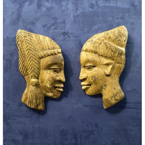 243 - A PAIR OF CARVED AFRICAN BUSTS IN PROFILE, hardwood carvings, can be mounted on a wall. Dimensions: ... 