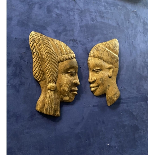 243 - A PAIR OF CARVED AFRICAN BUSTS IN PROFILE, hardwood carvings, can be mounted on a wall. Dimensions: ... 