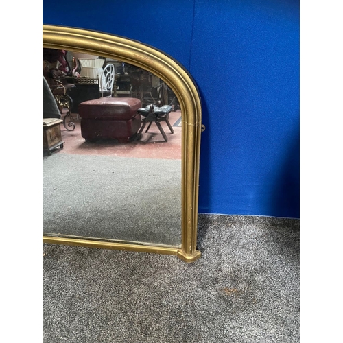 249 - A VICTORIAN GILT OVERMANTLE MIRROR, nice arched form with reeded gilt border. Dimensions: 136cm x 84... 