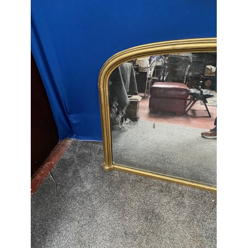 249 - A VICTORIAN GILT OVERMANTLE MIRROR, nice arched form with reeded gilt border. Dimensions: 136cm x 84... 