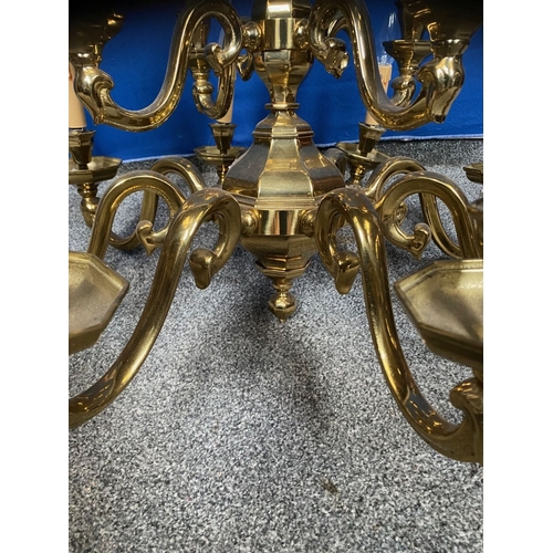 251 - A GOOD TWO TIER BRASS CHANDELIER, in working order. With four branches to top tier and eight branche... 