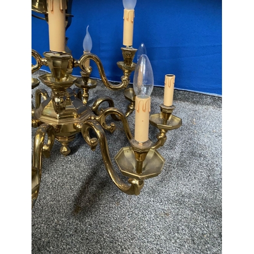 251 - A GOOD TWO TIER BRASS CHANDELIER, in working order. With four branches to top tier and eight branche... 