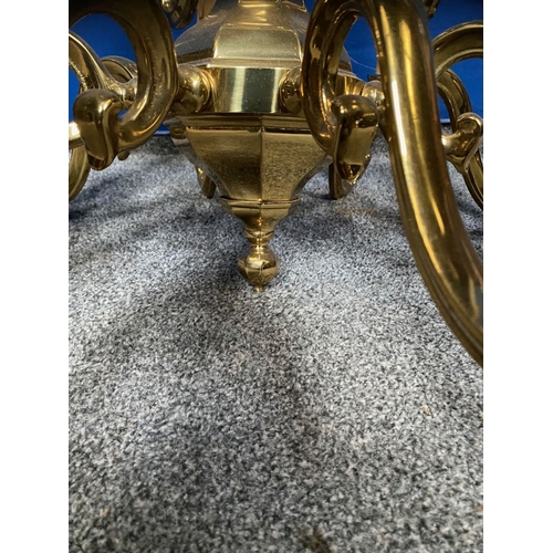 251 - A GOOD TWO TIER BRASS CHANDELIER, in working order. With four branches to top tier and eight branche... 