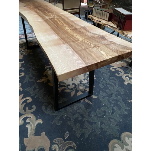 258 - A LONG RECLAIMED WOOD COFFEE TABLE, could be walnut/elm, on steel side supports. Dimensions: 214cm l... 