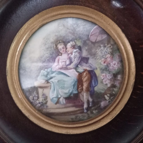 275 - A FRAMED MINIATURE PAINTING, in a wooden frame with circular concave centre and gilt coloured slip. ... 