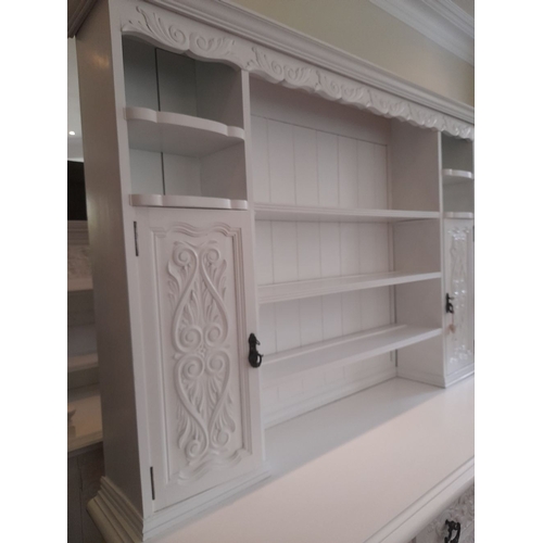 279 - A LARGE SOLID MAHOGANY PAINTED DRESSER, with cornice above carving, open shelves to centre with cupb... 