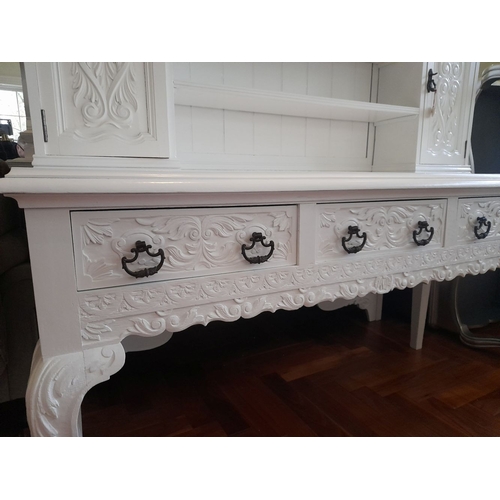 279 - A LARGE SOLID MAHOGANY PAINTED DRESSER, with cornice above carving, open shelves to centre with cupb... 