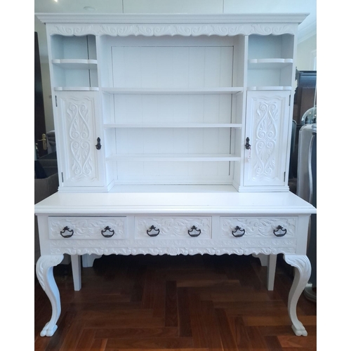 279 - A LARGE SOLID MAHOGANY PAINTED DRESSER, with cornice above carving, open shelves to centre with cupb... 