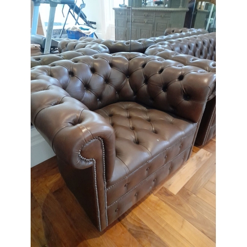 282 - AN EXCELLENT CHESTERFIELD BROWN LEATHER THREE SEATER COUCH AND ARMCHAIR, both have deep button uphol... 