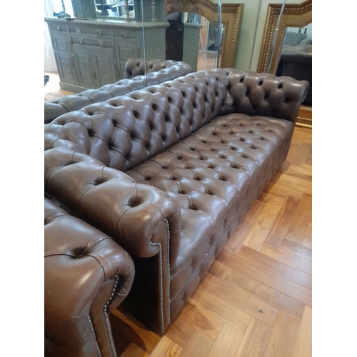 282 - AN EXCELLENT CHESTERFIELD BROWN LEATHER THREE SEATER COUCH AND ARMCHAIR, both have deep button uphol... 