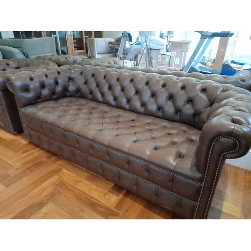 282 - AN EXCELLENT CHESTERFIELD BROWN LEATHER THREE SEATER COUCH AND ARMCHAIR, both have deep button uphol... 