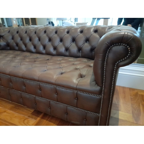 282 - AN EXCELLENT CHESTERFIELD BROWN LEATHER THREE SEATER COUCH AND ARMCHAIR, both have deep button uphol... 