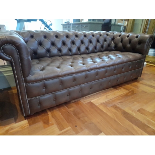 282 - AN EXCELLENT CHESTERFIELD BROWN LEATHER THREE SEATER COUCH AND ARMCHAIR, both have deep button uphol... 