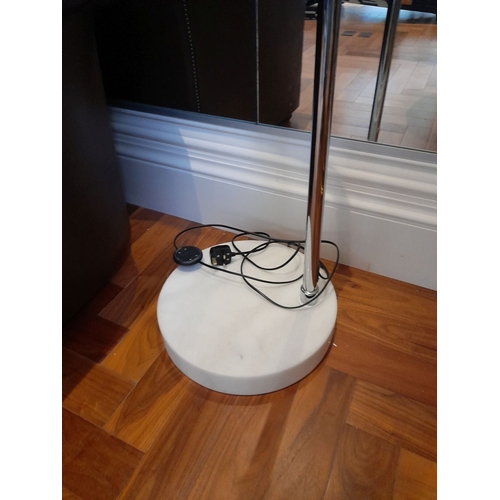 284 - A LARGE STAINLESS STEEL FLOOR LAMP, with curved support, on circular granite base. Dimensions: 198cm... 